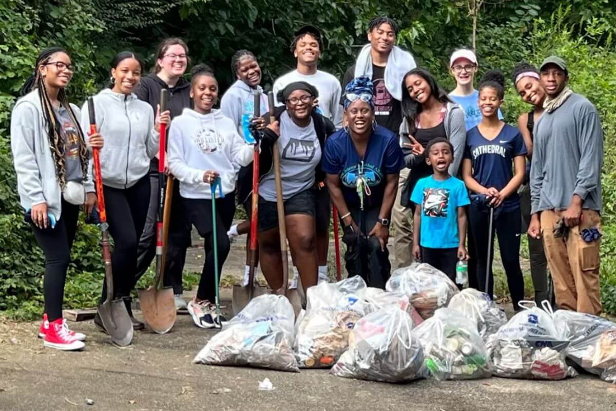 volunteers cleaning up litter at proctor creek habitat restoration day